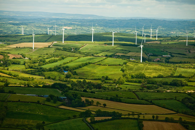 Green hills with a wind turbine field