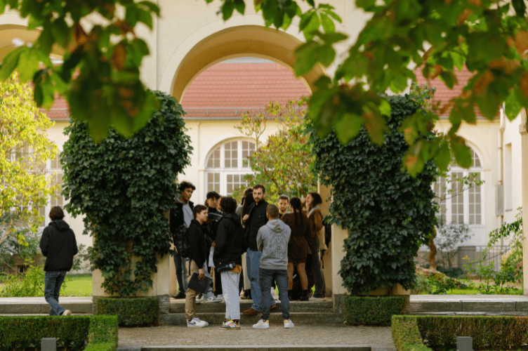 Group of students in the Berlin Campus Courtyard
